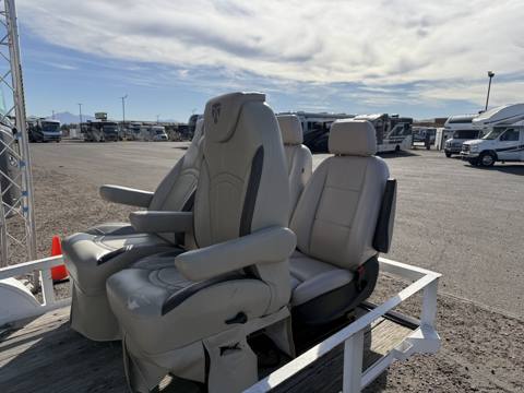 After: cream RV captain chairs on trailer outdoors