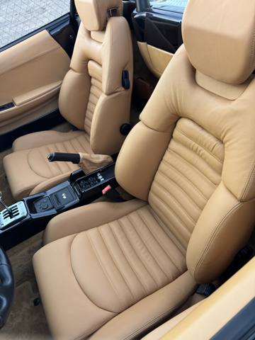 After: tan leather sports car seats, finished
