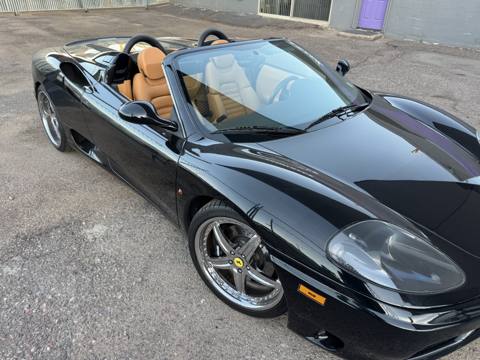 After: black convertible sports car with tan interior