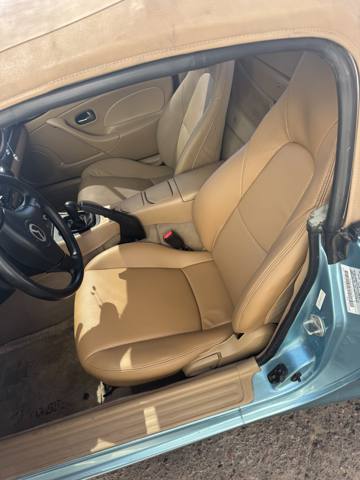 After: tan leather seats in roadster