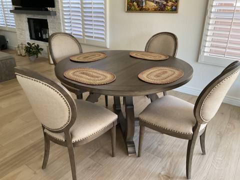 After: oval-back dining chairs around round table