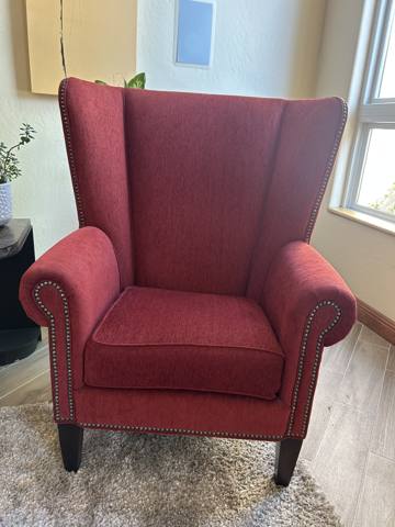 After: red wingback chair with nailhead trim