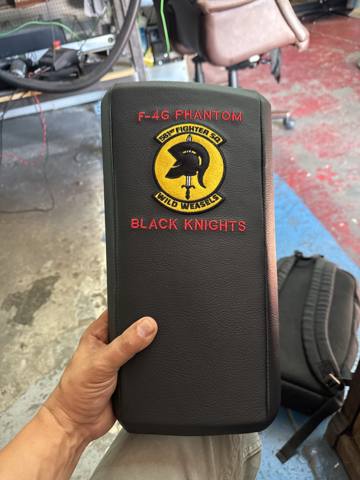 After: embroidered squadron insignia armrest cover, finished