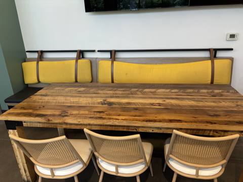 After: yellow banquette back cushions with leather straps