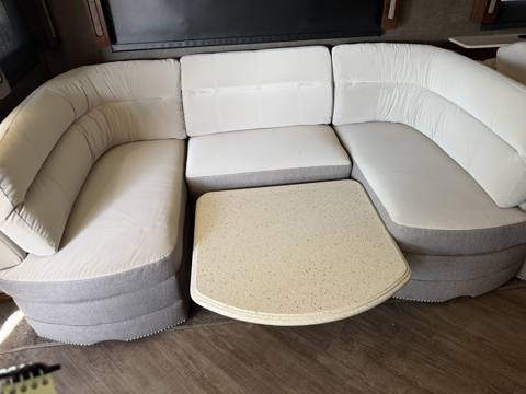 After: white curved RV dinette with gray base
