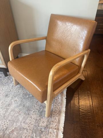 After: tan leather accent chair with wood arms