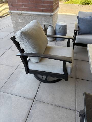 After: patio swivel chair with cream cushions