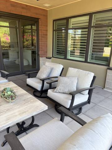 After: patio swivel chairs with white cushions