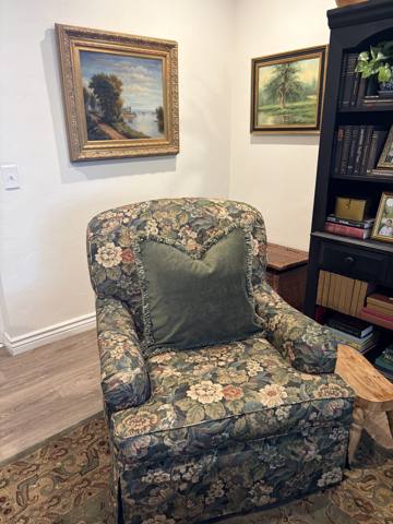 After: floral skirted armchair in study