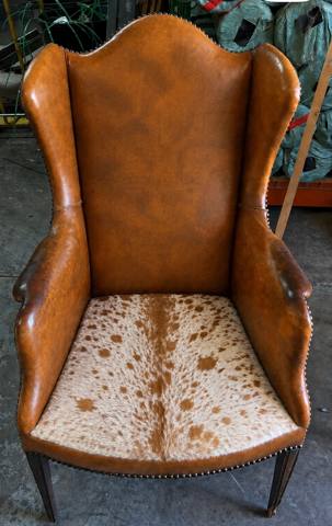 After: leather wingback chair with cowhide seat, nailhead trim