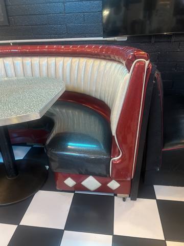 After: retro red and white channel-back diner booth